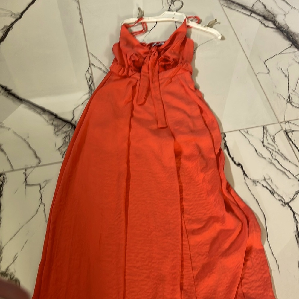 Relax in this comfortable spaghetti strap jumpsuit ties in the front,sm